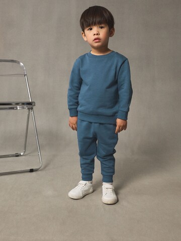 Set Next en bleu