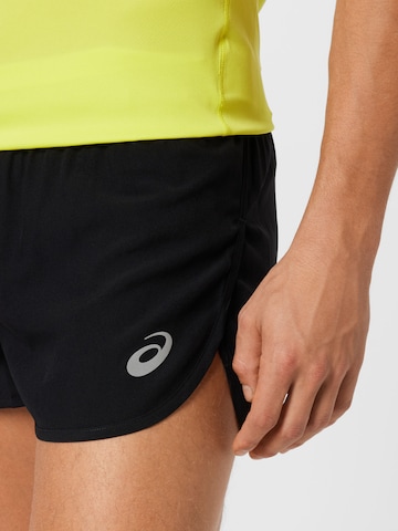ASICS Slimfit Spodnie sportowe 'Core Split' w kolorze czarny