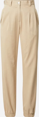 Guido Maria Kretschmer Women Tapered Pleat-Front Pants 'Nicola' in Beige: front