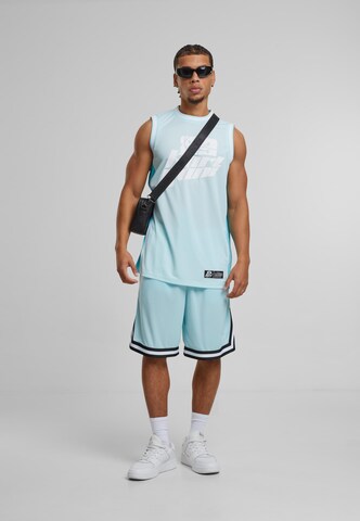 Karl Kani Loose fit Pants in Blue