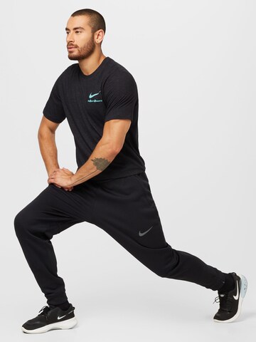 Tricou funcțional de la NIKE pe negru