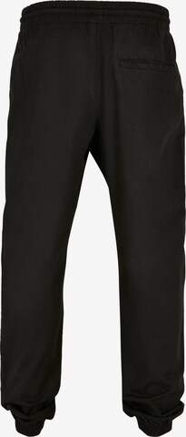 Tapered Pantaloni di Urban Classics in nero