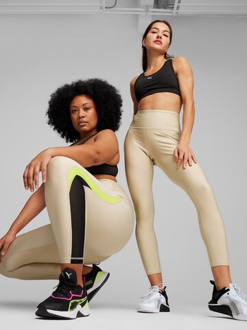 Skinny Pantaloni sportivi di PUMA in grigio