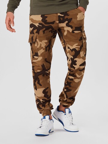 Urban Classics Tapered Cargo Pants in Brown: front