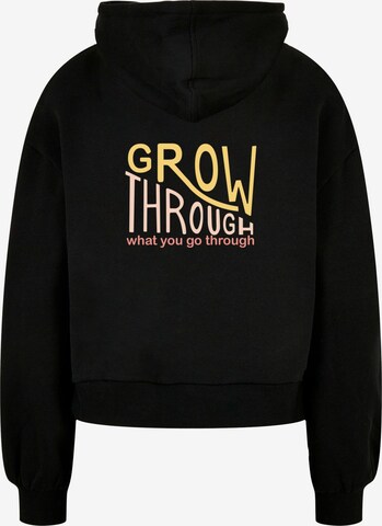 Merchcode Sweatshirt 'Spring - Grow Through' in Schwarz