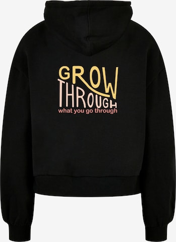 Merchcode Sweatshirt 'Spring - Grow Through' in Schwarz