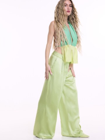 ABOUT YOU x Emili Sindlev Wide leg Pleat-front trousers 'Elva' in Green