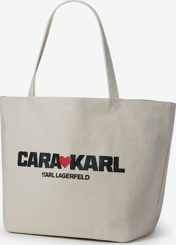 KARL LAGERFELD x CARA DELEVINGNE Nakupovalna torba | bež barva: sprednja stran