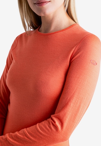ICEBREAKER Funkcionalna majica 'Oasis' | oranžna barva