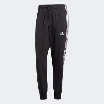 ADIDAS SPORTSWEAR Tapered Urheiluhousut 'Essentials' värissä musta: edessä