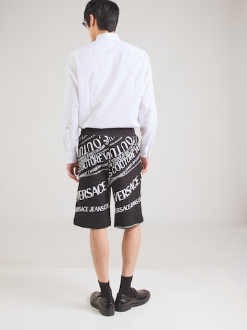 Loosefit Pantaloni di Versace Jeans Couture in nero