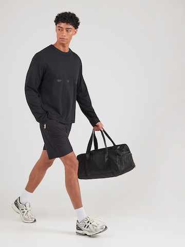 Loosefit Pantalon de sport 'Zimpatia' ELLESSE en noir