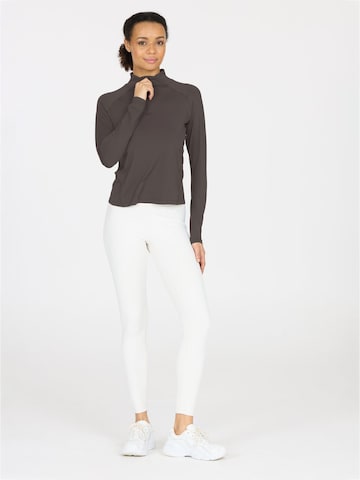 Athlecia Functioneel shirt 'Grina' in Bruin