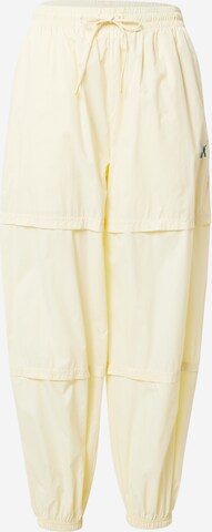 PUMA Tapered Trousers 'Crystal Galaxy' in Yellow: front