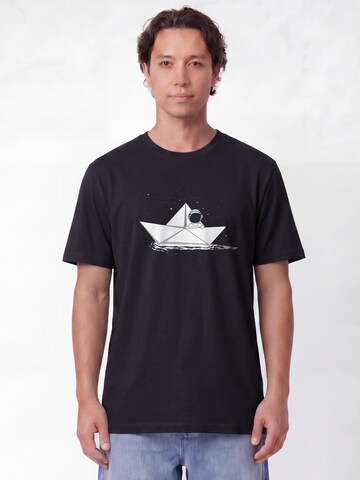 T-Shirt 'Astronaut In Paper Boat' Watapparel en noir : devant