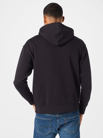 LEVI'S ®Regular Fit Sweater majica 'T3 Relaxd Graphic Hoodie' - crna boja