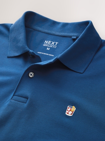 Tricou de la Next pe albastru