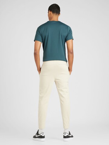 Slimfit Pantaloni sportivi 'Essential' di Jordan in beige