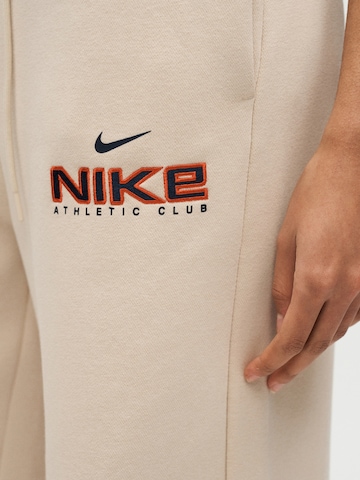 Nike Sportswear Wide leg Trousers 'CLS+ FLC' in Beige