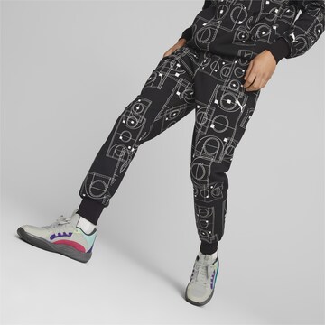 Effilé Pantalon de sport 'Courtside Booster' PUMA en noir : devant