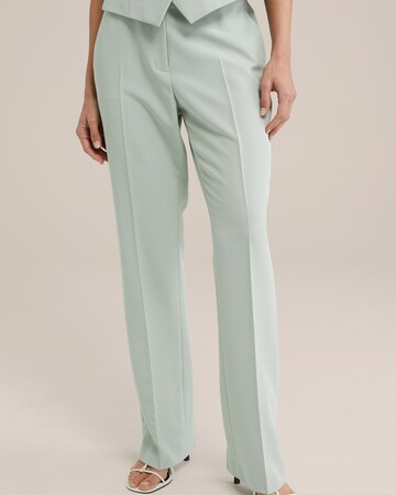 WE Fashion Regular Trousers with creases in Green: front