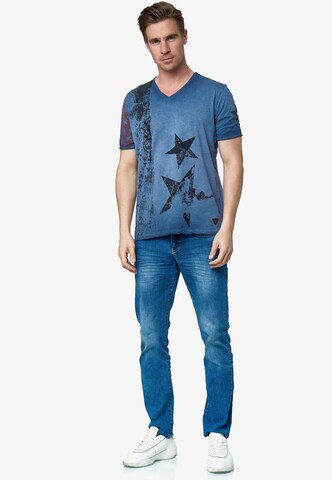 Rusty Neal Cooles T-Shirt mit V-Ausschnitt in Blau