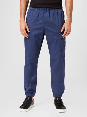 Nike Sportswear Tapered Trousers in Blue: front