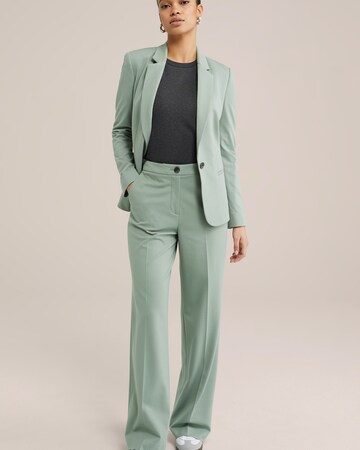 Wide leg Pantaloni con piega frontale di WE Fashion in verde