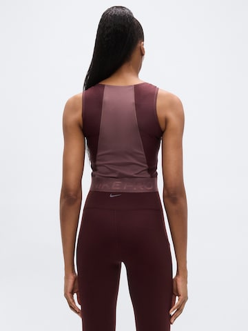 Sport top de la NIKE pe roșu