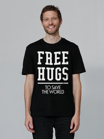 Watapparel Shirt ' Free hugs to save the world ' in Black: front