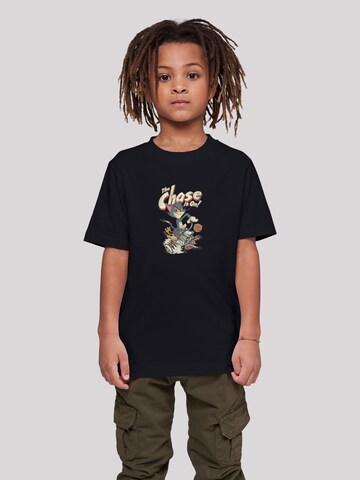 F4NT4STIC Shirt 'Tom And Jerry The Chase Is On' in Zwart: voorkant