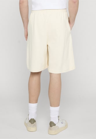 Regular Pantalon Karl Kani en beige