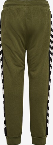 Effilé Pantalon de sport Hummel en vert