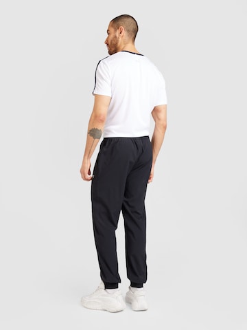 FILA - Tapered Calças de desporto 'Westley' em preto