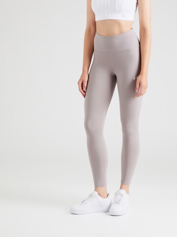 Skinny Pantalon de sport 'Motion' UNDER ARMOUR en violet : devant
