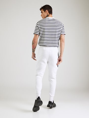 Nike Sportswear Tapered Παντελόνι 'TCH FLC' σε λευκό