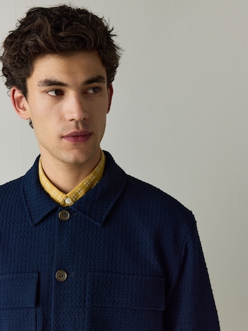 Next Tussenjas in Blauw