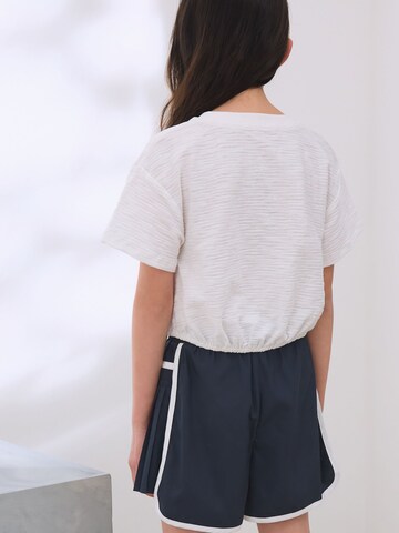T-Shirt Next en blanc