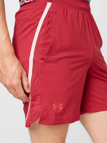 Regular Pantalon de sport UNDER ARMOUR en rouge