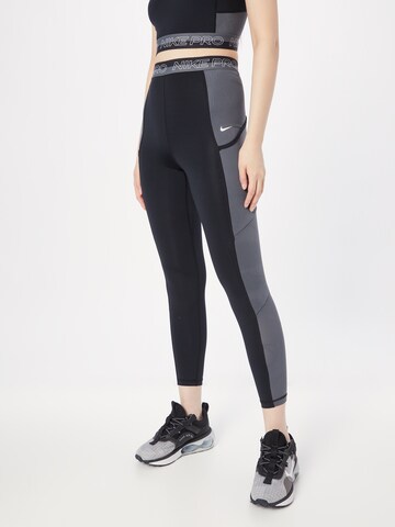 NIKE Skinny Sports trousers in Black: front