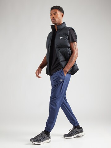 new balance Конический (Tapered) Спортивные штаны 'Essentials Active' в Синий