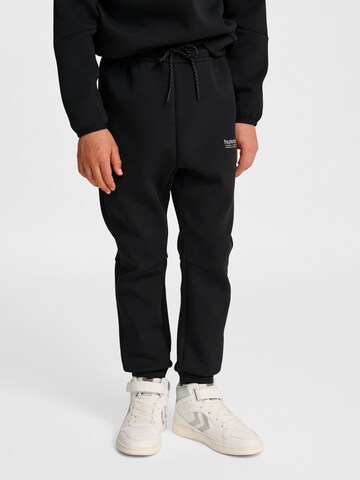 Effilé Pantalon de sport Hummel en noir