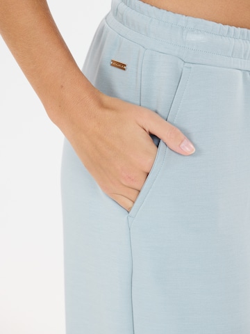 Athlecia - Tapered Pantalón deportivo 'Jacey' en azul