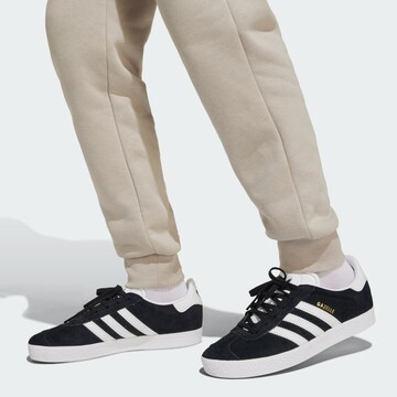 ADIDAS ORIGINALSTapered Sportske hlače 'Messi' - siva boja