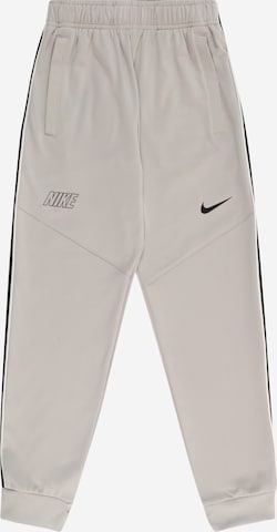 Nike Sportswear Tapered Trousers in Grey: front