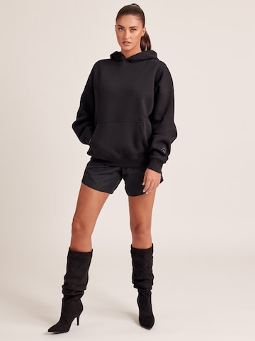 ABOUT YOU x Antonia Sweatshirt 'Kaili' in Black: front