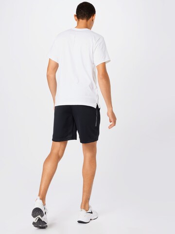 Nike Sportswear Normální Kalhoty 'Tribute' – černá