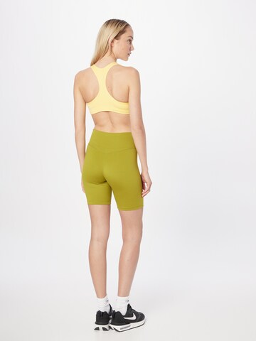 NIKE Skinny Workout Pants in Yellow