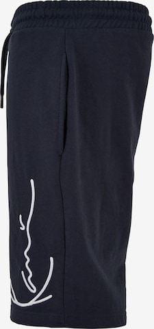 Karl Kani Regular Trousers in Blue