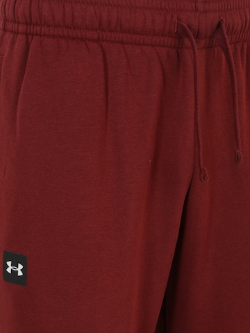 UNDER ARMOUR Tapered Sportsbukser 'Rival' i rød